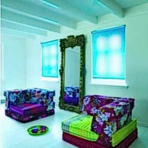 Рулонные шторы в гостиной фото в интерьере пример 1634